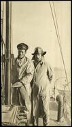 Two crewmen on the gasoline launch "Kipling"