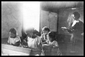 Kathleen Dewdney in Ingram Mountain School classroom with students