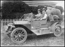 James and son Arthur Haddock in automobile with furs