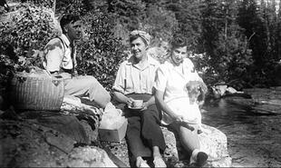 Gideon Berube, Jean and Madelaine having a picnic by river
