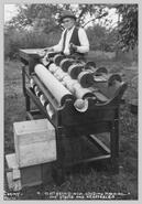 M. McQueen with his new grading machine for fruit & vegetables