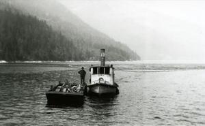 Tugboat towing biggest boom to Slocan City for Jennings's sawmill