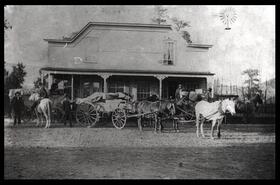 Horses and wagons outside A.E. Howse Store in Nicola