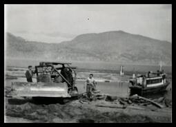 Shovel tractor and boat at Okanagan Lake 