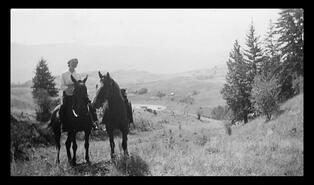 Woman on horseback at Solvi Thorlakson Ranch, Commonage