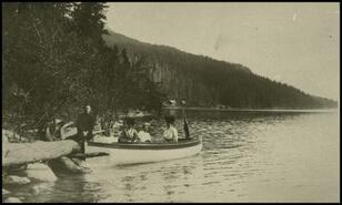 Group with a boat at Six Mile Creek (Nemo) on Slocan Lake