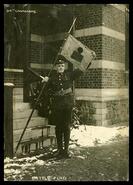 Soldier holding 54th Canadians colours