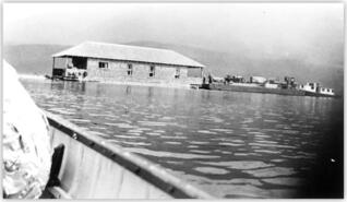 Moving Simard's houseboat on Mabel Lake