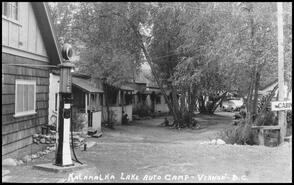 Postcard of the cabins and gas station at the Kalamalka Lake Auto Camp