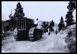 Bulldozer pulling grader during construction of Stump Lake Road