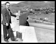 Eric Reich looks over Highway 97 overpass during construction