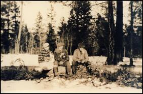 Mollie and Alfred Laird with Frank Edgell sitting on log