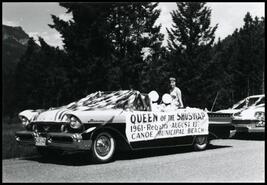 Decorated car carrying Queen of the Shuswap in Falkland Stampede parade