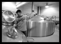 Curt Wenzlaff, brewer, taking malt sample for an iodine test at Okanagan Spring Brewery