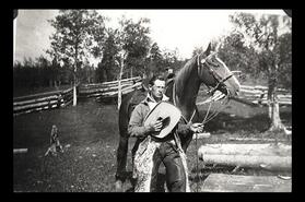 Unidentified cowboy with horse
