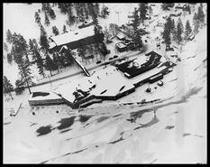Aerial view of snow covered Okanagan Centre packing house in winter