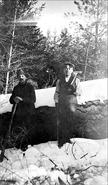 Bill Tucker and Ernie Hann cutting wood at Vernon