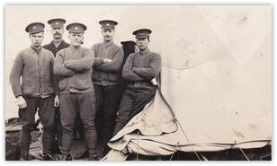 Wheeler Boys in group in front of tent