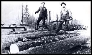 Louis Rauch sorting Columbia River Lumber Company logs from boom