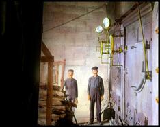 Two workers in steam room of community flour mill?, Veregin, Saskatchewan