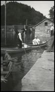 Men in boats outside Finlayson's Store during 1948 Sicamous flood