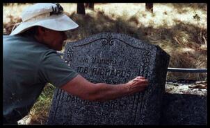 Vivian Kroeker cleaning Job and Carrie Richards' grave stone