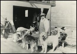 Andy Patterson and dogs on deck of S.S. White Smith