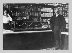 Cecilia Watson with undentified men in Maundrell's Meat Market
