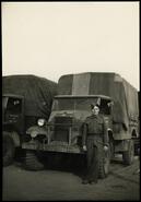 Bill Mundry in uniform with truck