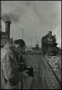 [Unidentified man taking photographs on the C.P.R. wharf, Penticton]