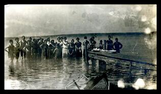 Group of swimmers at lake, unknown location