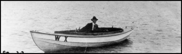 George Wilcox in W.X. boat