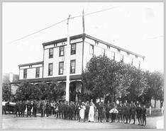Militia and others in front of Armstrong Hotel