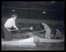 Canoe jousting in Civic Arena, B.C. Centennial Sportsman's show