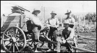 Men with wagon at Vernon Orchard Co.