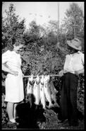 "Margaret and Freddie" holding a catch of fish