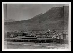 Town of Fernie with a C.P.R. train at station in the foreground