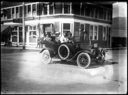 1913 McLaughlin automobile with passengers