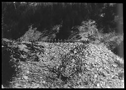 Wooden flume with slope of small rocks at Northcote Caesar mine, Big Bend