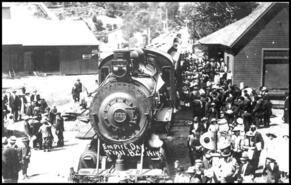 Crowd gathered at Trail Train railway station on Empire Day