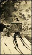 Man pushing gypsum rail car