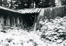 David Wilford and Jack Farrell at Bill Drinnon's first trapping cabin up Hoder Creek, Little Slocan