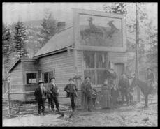 Group in front of Clegg Harness Shop, Chase, B.C.