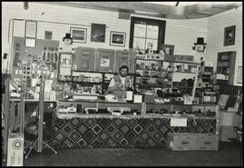 Unidentified man behind counter at the Red Barn