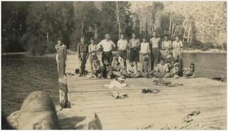 Boy Scouts out of uniform on dock at Chute Creek