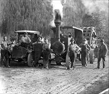 Enderby farmers standing in front of a steam tractor