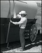 Ab Portman adjusting fake covered wagon