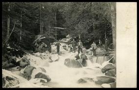 Group of men in the river near Patrick's Lumber camp in Little Slocan