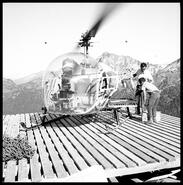Men with helicopter on loading platform at mine, Mt. Copeland