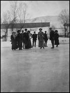 Group ice skating on Kalamalka Lake